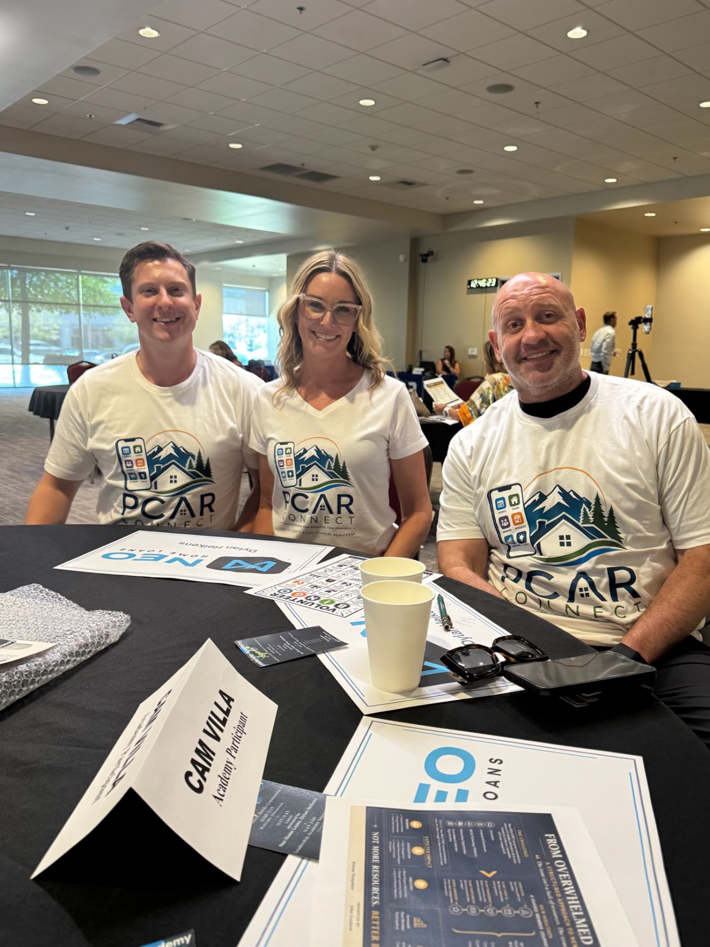 The PCAR Connect team — Marc Gabris, Cyndy Silva, and Cam Villa — wearing PCAR Connect shirts at the Leadership Academy